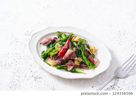 Stir-fried firefly squid and rape blossoms with garlic Stir-fried firefly squid and rape blossoms with garlic 124336506