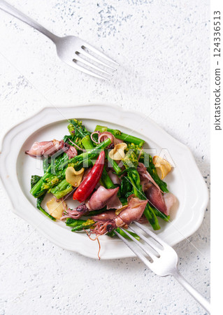 Stir-fried firefly squid and rape blossoms with garlic Stir-fried firefly squid and rape blossoms with garlic 124336513