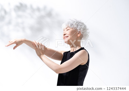 Stretching massage gray hair woman Stretching massage gray hair woman 124337444