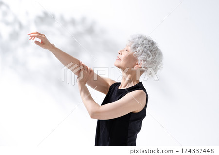 Stretching massage gray hair woman Stretching massage gray hair woman 124337448