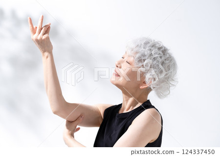 Stretching massage gray hair woman Stretching massage gray hair woman 124337450