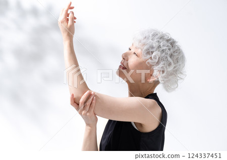 Stretching massage gray hair woman 124337451