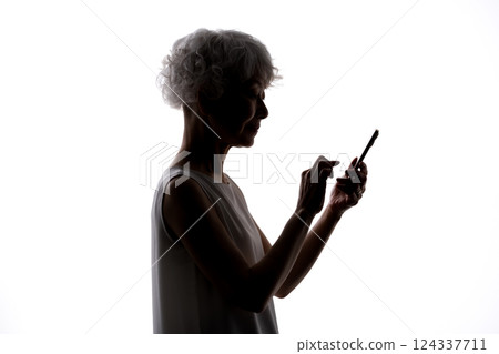 Senior woman silhouette smartphone 124337711