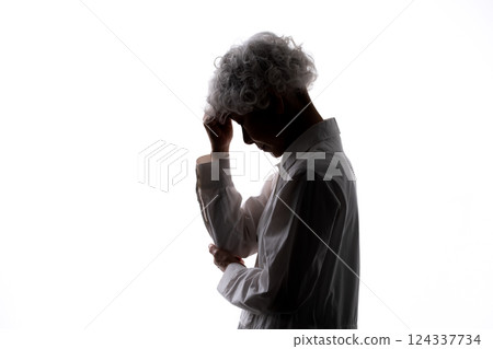 Worried senior woman silhouette 124337734