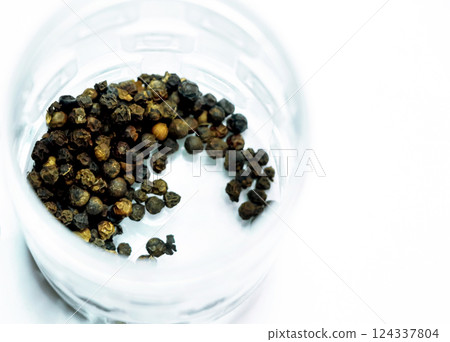Black pepper isolated on a white background Black pepper isolated on a white background 124337804