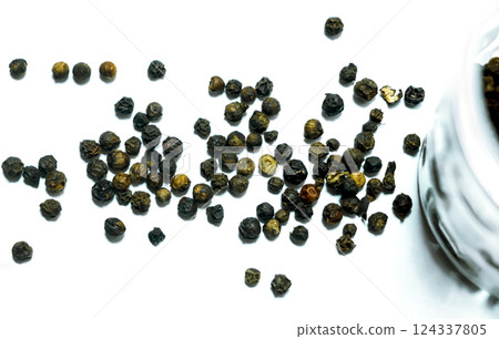 Black pepper isolated on a white background Black pepper isolated on a white background 124337805