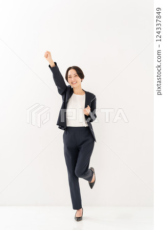 Woman business whole body fist pump Woman business whole body fist pump 124337849
