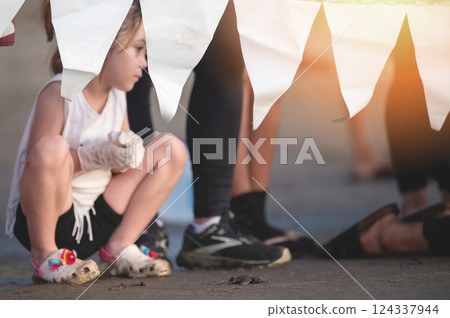 Kid girl released baby turtle on sea beach Kid girl released baby turtle on sea beach 124337944
