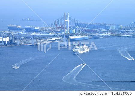 Yokohama cityscape, Japan. First port arrival. Europa 2 passing through Yokohama Bay Bridge. Daikoku Pier is in the background. March 25th. Yokohama cityscape, Japan. First port arrival. Europa 2 passing through Yokohama Bay Bridge. Daikoku Pier is in the background. March 25th. 124338069