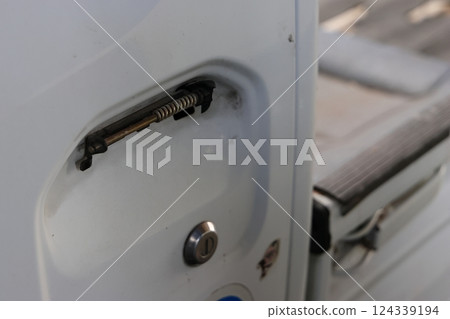 Cracked and broken car door handle Cracked and broken car door handle 124339194