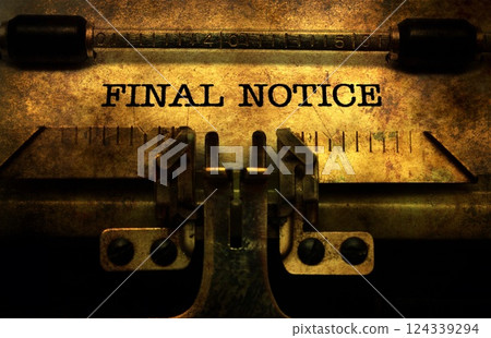 Final notice in typewriter 124339294