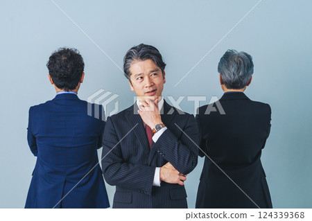 A group of middle-aged male business people having trouble with relationships 124339368