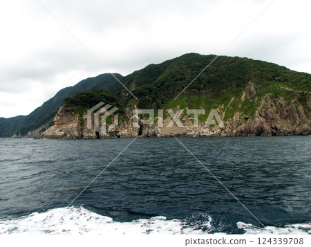 Sheer cliffs seen from a sightseeing boat Sheer cliffs seen from a sightseeing boat 124339708