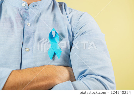 Support for men's health with a blue ribbon representing prostate awareness Support for men's health with a blue ribbon representing prostate awareness 124340234