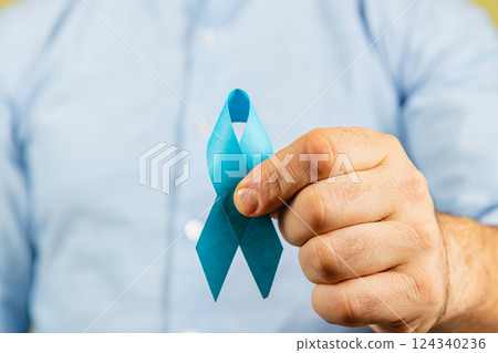 Support for cancer awareness with blue ribbon in charity event for prevention 124340236