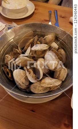 Steamed Clams Served in a Metal Bucket at a Seafood Restaurant in New Hampshire Steamed Clams Served in a Metal Bucket at a Seafood Restaurant in New Hampshire 124340443