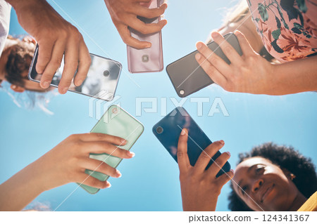 Phone circle, hands of people and low angle, communication or text. Blue sky, mobile and friends on social media, online group chat or wifi, sharing 5g data and surfing internet, web or online. Phone circle, hands of people and low angle, communication or text. Blue sky, mobile and friends on social media, online group chat or wifi, sharing 5g data and surfing internet, web or online. 124341367
