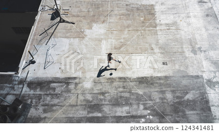Top view, soccer player and man in fitness, training and workout practice on city building rooftop in Portugal. Sports athlete, football player and person with soccer ball in health wellness exercise Top view, soccer player and man in fitness, training and workout practice on city building rooftop in Portugal. Sports athlete, football player and person with soccer ball in health wellness exercise 124341481
