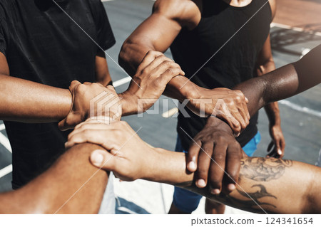 Diversity team, friends and basketball holding hands for trust, partnership or community goal on New york basketball court. Motivation, support or sports unity for fitness, training or health workout 124341654