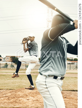 Baseball player, bat and pitcher on field for sports, fitness and competition in summer sun. Baseball, pitch and game on sand, grass or stadium for sport at baseball game in sunshine for winning 124341676