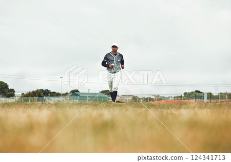 Baseball player running on a baseball field for training, sport and fitness in physical, competitive game. Sports, health and baseball with a man athlete at the start of a match on a field outdoors 124341713