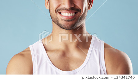 Smile, man and teeth for dental health in studio, wellness and orthodontics treatment on blue background. Tooth whitening, clean and person with shine, face and oral care with veneers for hygiene 124341740