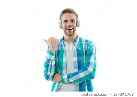 Millennial man gen lifestyle. Lifestyle and music. Man listen music in audio headphones isolated on white. Student millennial man lifestyle. Music style. Listen audio book. Point finger 124341768