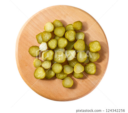 chopped pickled cucumbers on a cutting board  isolated on a white background, top view. 124342256