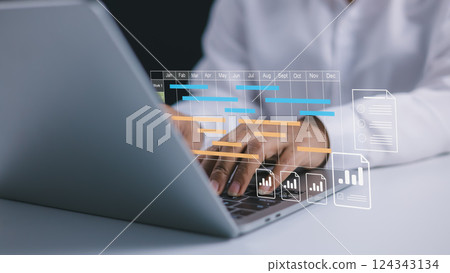 Project management tool and work schedule concept, Planning software, Businesswoman use laptop to manager working projects and update task with gantt chart schedule to business plan and progress. Project management tool and work schedule concept, Planning software, Businesswoman use laptop to manager working projects and update task with gantt chart schedule to business plan and progress. 124343134