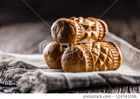 Oscypki - Traditional salty smoked cheese made from sheep's milk from the Polish region of Zakopane under the High Tatras 124343196