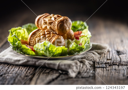 Oscypki - Traditional salty smoked cheese made from sheep's milk from the Polish region of Zakopane under the High Tatras. 124343197