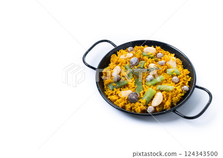 Traditional Valencian paella with rabbit, chicken, garrofon beans, snails, Moroccan green beans and saffron isolated on white background 124343500