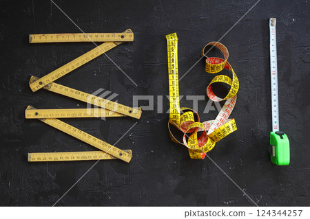 Yellow Measuring tape for tool roulette or ruler. Tape measure template in centimeters Yellow Measuring tape for tool roulette or ruler. Tape measure template in centimeters 124344257