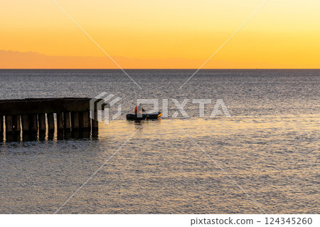 Beautiful sunset on the Black sea. Gold sea sunset. Poti 124345260