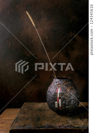Dried Grass Stem in Ceramic Vase 124345616