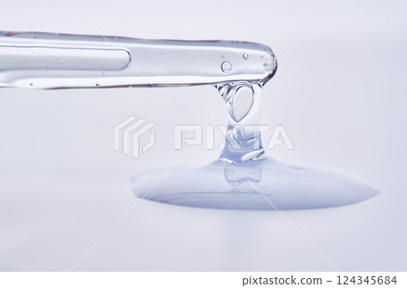 Pipette with delicate blue serum close-up. Pipette with delicate blue serum close-up. 124345684