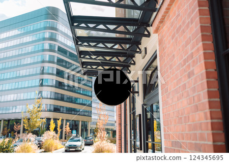 Close-up of a Building Facade with Store Sign and Modern Architecture 124345695