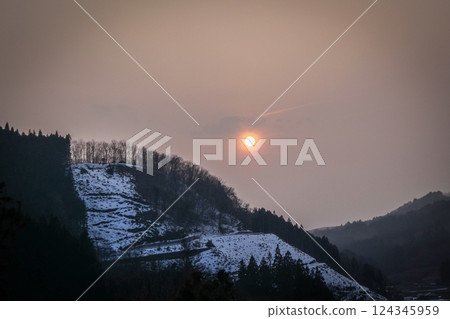The sun setting over the mountains of Tono, the village of folk tales 124345959