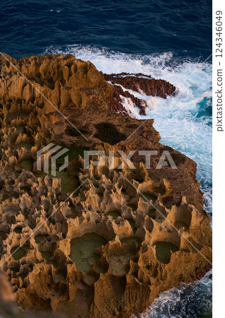 Cinematic aerial landscape shots of the beautiful island of Nusa Penida. Huge cliffs by the shoreline and hidden dream beaches with clear water and foaming wave. Cinematic aerial landscape shots of the beautiful island of Nusa Penida. Huge cliffs by the shoreline and hidden dream beaches with clear water and foaming wave. 124346049