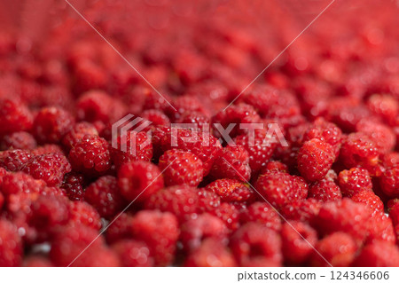 Summer red raspberry with a blurred part and a place for text. Background image 124346606