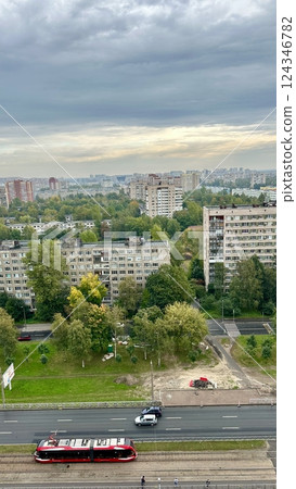 A summer view of an area of the city with lots of grass and trees A summer view of an area of the city with lots of grass and trees 124346782