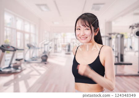 Young woman running in the gym 124348349