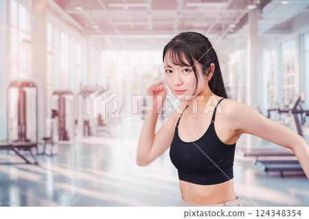 Young woman running in the gym 124348354