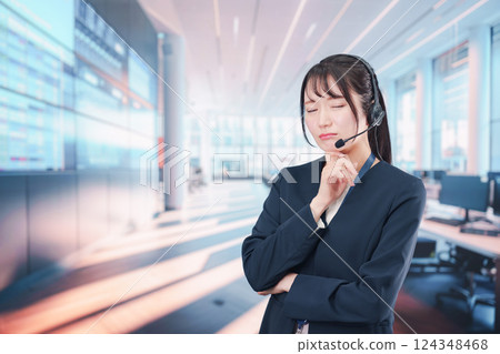 A female telephone operator with a troubled expression 124348468