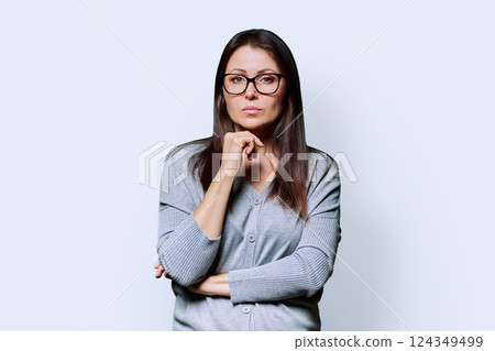 Portrait of serious business mature woman on white background 124349499