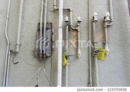 Plumbing in an old dilapidated building 124350686