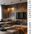 Elegant living room boasts warm wooden paneling, plush seating, a large flatscreen TV, and abstract art, offering a cozy and inviting atmosphere for relaxing and entertaining 124351170