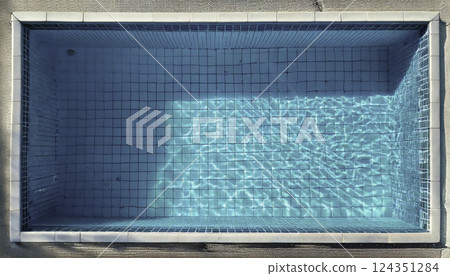 Topdown view of a small, rectangular swimming pool Topdown view of a small, rectangular swimming pool 124351284