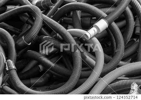 Plastic hoover hoses outside 124352714