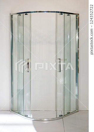 Closed oval shower in bathroom 124352722